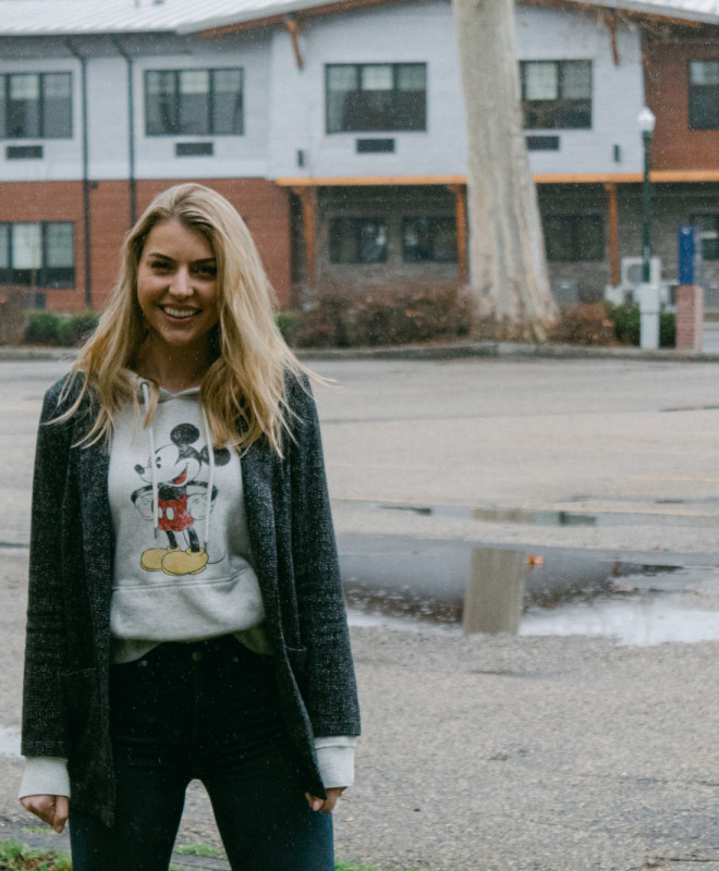 girl wearing mickey sweatshirt